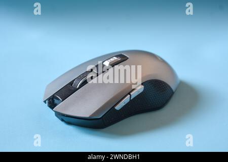 Gray color mouse on a blue background. Stock Photo