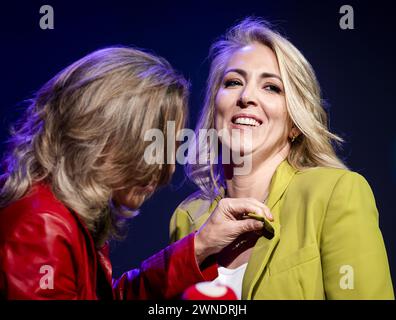 BUSSUM - Agnes Kant (L) presents a Golden Tomato to former party leader Lilian Marijnissen during her farewell at the SP party conference. Marijnissen is leaving because she believes her party needs 'a new face' after losing elections again in November. ANP SEM VAN DER WAL netherlands out - belgium out Credit: ANP/Alamy Live News Credit: ANP/Alamy Live News Stock Photo