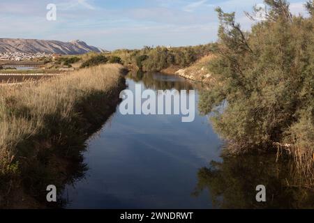 a channel that drains rainwater around the salt pan Stock Photo