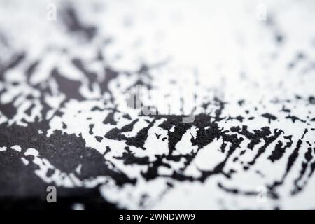 Extreme close up of black acrylic paint texture on paper. Selective ...