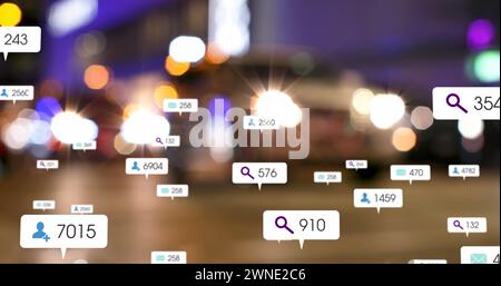 Image of social media icons and numbers on banners over out of focus traffic in city Stock Photo