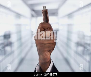 Hands, person and flash drive technology for data transfer, storage or backup memory on hardware. Closeup, fingers and digital usb stick for software Stock Photo