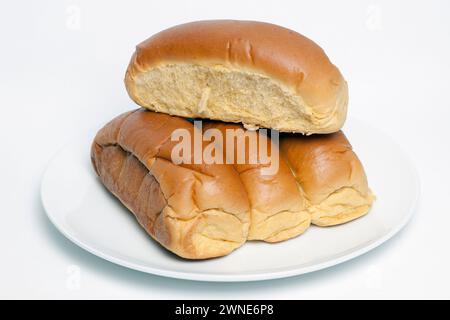 4 Organic Sweet Potato Bread  Rolls on a Plain White Plate Stock Photo
