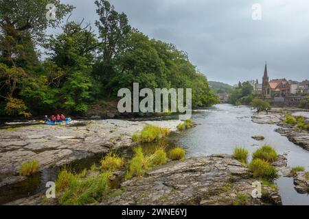 White water rafters rafting on the River Dee at Llangollen in North Wales, UK Stock Photo