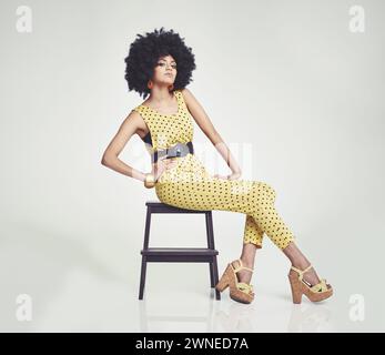 Fashion, retro and portrait of black woman in studio for funky, cool and vintage style. Culture, casual and stylish with face of female person on Stock Photo