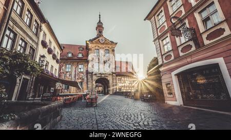 Sunrise through the gate of a historic building in a European old town, Bamberg's old town hall Stock Photo