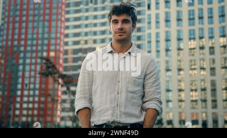 Caucasian man millennial thoughtful male looking away outdoors confident calm guy businessman look camera smile confidence handsome model boyfriend Stock Photo