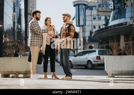 Young entrepreneurs engaging in an outdoor business meeting, strategizing over market trends Stock Photo