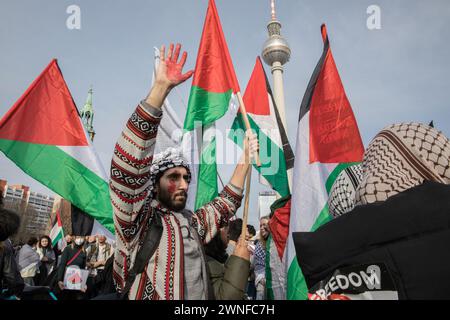 Berlin, Germany. 02nd Mar, 2024. March 2, 2024, Berlin, Germany: In Berlin, on March 2, 2024, a protest took place amidst the Israel-Hamas war in Gaza. The rally started at the Neptunbrunnen and involved a large crowd vocalizing a series of slogans. Among the slogans chanted by the protestors were phrases such as ''Free Palestine'' and ''Resistance is justified when Palestine is occupied.'' They also included direct criticisms of global political leaders, with chants like ''Biden, you will see, Palestine will be free, '' pointing to dissatisfaction with international support for Israel. Credit Stock Photo