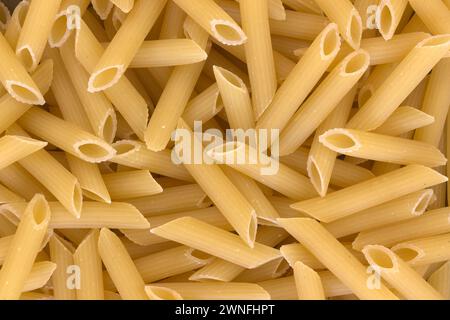 The Italian Pasta Penne. Closeup View From Above For Solid Background Usage. Stock Photo