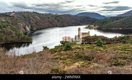 Located in the town of Saint-Just-Saint-Rambert, Grangent Castle is located on a small island in the lake of the same name. France Stock Photo