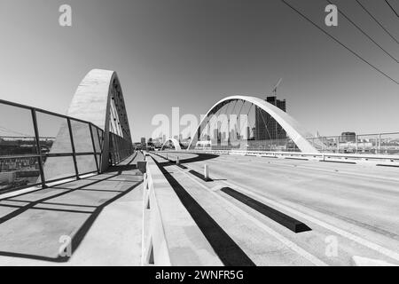 Black and white view of the 6th Street Bridge and downtown Los Angeles in Southern California. Stock Photo
