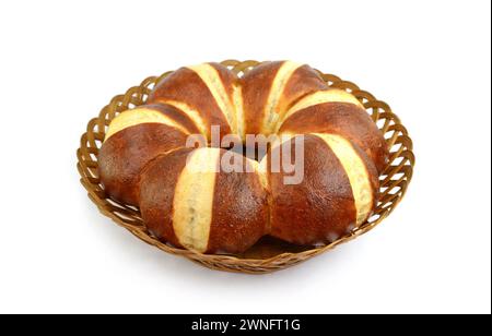 Freshly baked traditional German laugenbrot. Bavarian homemade pretzel rolls lye bread, close-up, isolated on white background. Stock Photo