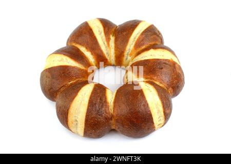 Freshly baked traditional German laugenbrot. Bavarian homemade pretzel rolls lye bread, close-up, isolated on white background. Stock Photo