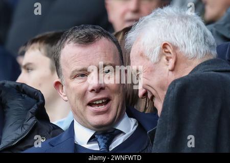 Managing director of Leeds United Angus Kinnear speaks with former player Eddie Gray in attendance during the Sky Bet Championship match Huddersfield Town vs Leeds United at John Smith's Stadium, Huddersfield, United Kingdom, 2nd March 2024  (Photo by James Heaton/News Images) Stock Photo