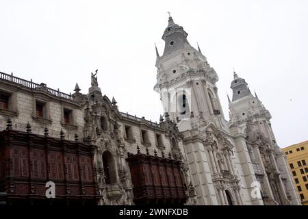 The Basilica Cathedral of Lima on Plaza Mayor or Plaza de Armas. Located in the Historic Centre of Lima, Peru. People and tourists stroll on square. Stock Photo