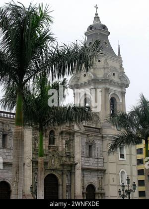 The Basilica Cathedral of Lima on Plaza Mayor or Plaza de Armas. Located in the Historic Centre of Lima, Peru. People and tourists stroll on square. Stock Photo