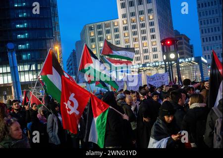 Berlin, Germany. 02nd Mar, 2024. Participants in a demonstration under the name 'Global South Resists' stand on Potsdamer Platz. According to a police spokeswoman, it was mainly pro-Palestinian demonstrators who gathered there. The call to protest stated that they wanted to end 'colonialism, racism and white supremacy' together. Credit: Christophe Gateau/dpa/Alamy Live News Stock Photo