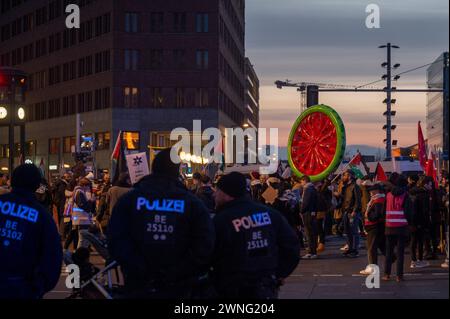 Berlin, Germany. 02nd Mar, 2024. Police officers stand between participants of a demonstration under the name 'Global South Resists' on Potsdamer Platz. According to a police spokeswoman, it was mainly pro-Palestinian demonstrators who gathered there. The call to protest stated that they wanted to end 'colonialism, racism and white supremacy' together. Credit: Christophe Gateau/dpa/Alamy Live News Stock Photo