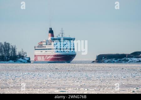 Helsinki / Finland - FEBRUARY 19, 2024: Passenger car ferry MV Gabriella, operated by Viking Line, passing the strait of Kustaanmiekka on clear winter Stock Photo