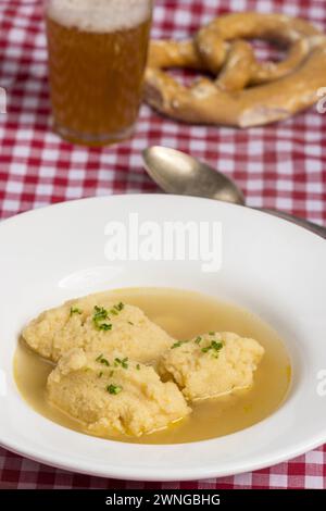 Bavarian Dumpling Soup On Tablecloth Stock Photo