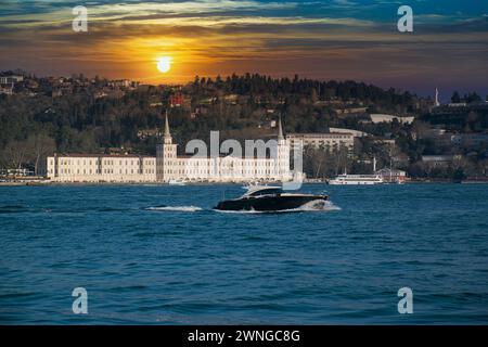 Power boat taxi in Bosphorus Strait moving fast and splashing water. Anatolian Site of Istanbul and Bosphorus Bridge in the background. Stock Photo