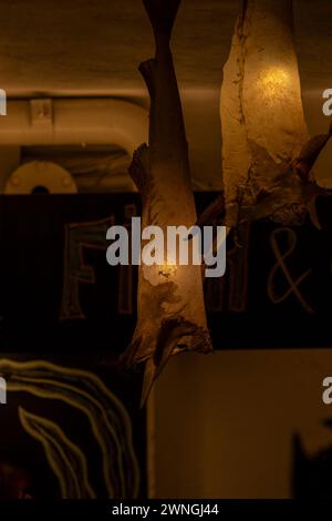 Codskin chandelier in Reykjavik's central fish and chips restaurant Stock Photo