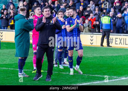 Newport, UK. 02nd Mar, 2024. Nigel Clough, the Manager of Mansfield Town applauds the fans at the final whistle of the EFL football league two match, Newport County v Mansfield Town at Rodney Parade in Newport, Wales on Saturday 2nd March 2024. This image may only be used for Editorial purposes. Editorial use only, pic by Credit: Andrew Orchard sports photography/Alamy Live News Stock Photo