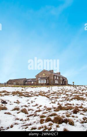 The Cat and Fiddle Forest Distillery seen from the snow covered Axe Edge Moor Cheshire Peak District during winter, former 2nd highest pub in England Stock Photo