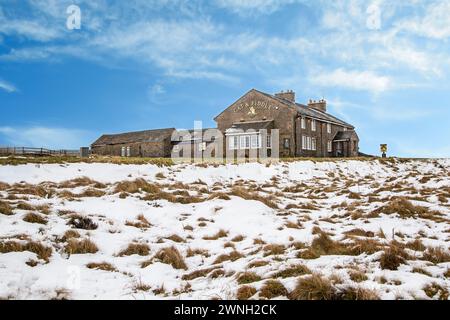 The Cat and Fiddle Forest Distillery seen from the snow covered Axe Edge Moor Cheshire Peak District during winter, former 2nd highest pub in England Stock Photo