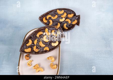 Dark Belgian chocolate Easter egg, filled with cupuaçu jam and cashew nuts 1.  Stock Photo