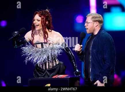 Bimini Bon Boulash and Rob Beckett on stage to present the award for International Song of the Year during the Brit Awards 2024 at the O2 Arena, London. Picture date: Saturday March 2, 2024. Stock Photo
