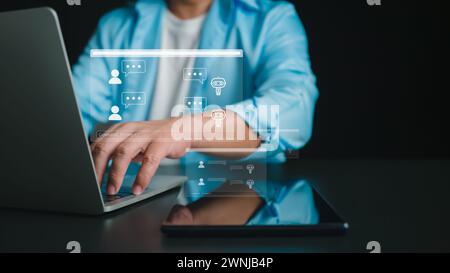 Businessman chatting with a smart AI using an artificial intelligence chatbot developed by OpenAI, Chat GPT concept, Artificial intelligence system su Stock Photo