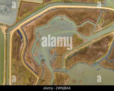 Aerial view of the Bassa de les Olles wetland in winter, north of the Ebro Delta (Tarragona, Catalonia, Spain) ESP: Vista aérea del humedal Delta Ebro Stock Photo