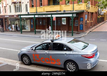 Sydney taxi car from 13 cabs parked in George street Sydney city centre opposite the Observer public house bar, Sydney,Australia Stock Photo