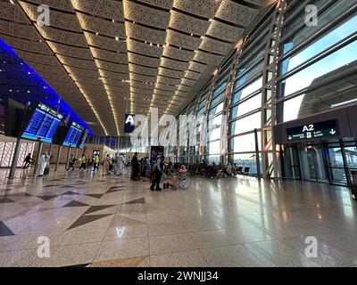 Jeddah , Saudi Arabia - Mar 11 2023 : Passengers traveling through King Abdulaziz International Airport - flight  and booking concept Stock Photo