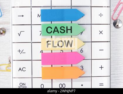 Cash flow text written on arrow-shaped stickers Stock Photo