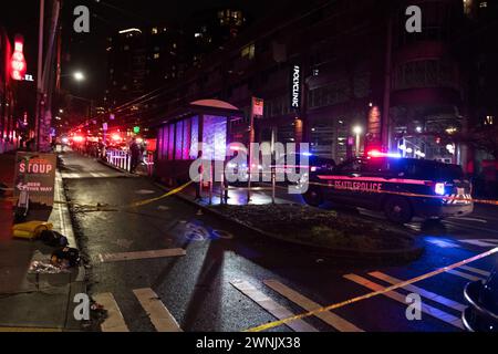 Seattle, USA. 2nd Mar 2024. Just after 11:00pm police rush to Union and Broadway on Capitol Hill after a report of three people shot outside a popular bowling alley. Three victims were located and rushed to Harborview. Credit: James Anderson/Alamy Live News Stock Photo