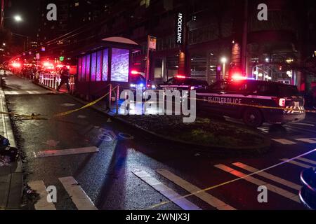 Seattle, USA. 2nd Mar 2024. Just after 11:00pm police rush to Union and Broadway on Capitol Hill after a report of three people shot outside a popular bowling alley. Three victims were located and rushed to Harborview. Credit: James Anderson/Alamy Live News Stock Photo