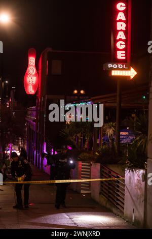 Seattle, USA. 2nd Mar 2024. Just after 11:00pm police rush to Union and Broadway on Capitol Hill after a report of three people shot outside a popular bowling alley. Three victims were located and rushed to Harborview. Credit: James Anderson/Alamy Live News Stock Photo