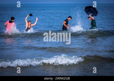 Heringsdorf, Germany. 02nd Mar, 2024. Actors Oliver Mommsen (left), Roman Knizka (2nd from left), Bernhard Bettermann (2nd from right) and Hendrik Duryn (right) take a dip in the water of the Baltic Sea in historical costumes after the 'Baltic Lights' sled dog race. To collect donations for Welthungerhilfe, professionals and celebrities compete against each other in teams of 500 huskies on the beach. Around 60,000 spectators are expected to attend the multi-day charity event at the weekend. Credit: Jens Büttner/dpa/Alamy Live News Stock Photo