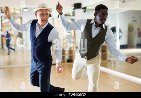 Two professional dancers practicing lindy hop in dance class Stock Photo