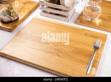 Fancy restaurant table settings with modern bamboo board Stock Photo