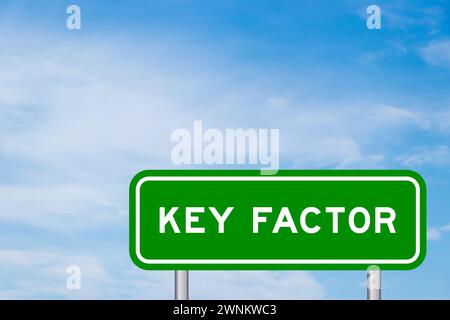 Green color transportation sign with word key factor on blue sky with white cloud background Stock Photo