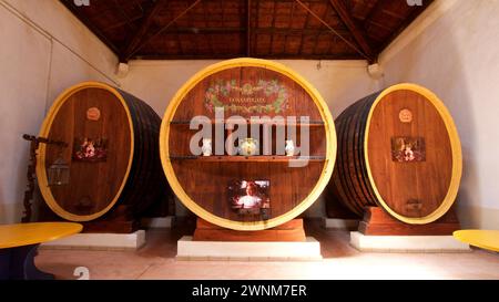 Three large wine barrels, artistically painted and used as wall decoration in a wine cellar, Donna Fugata, Sicilian wine, Sicily, Italy Stock Photo