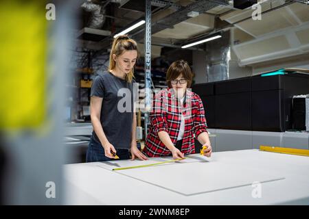 Professional female employees working in a printing house Stock Photo