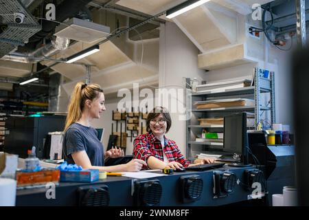 Professional female employees working in a printing house Stock Photo