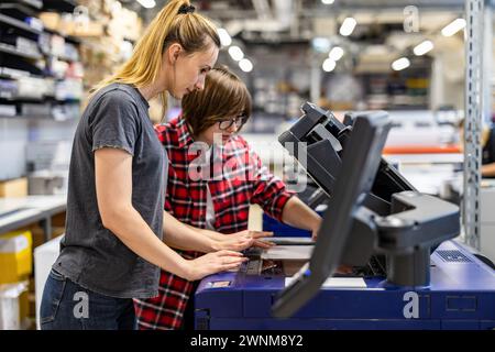 Professional female employees working in a printing house Stock Photo