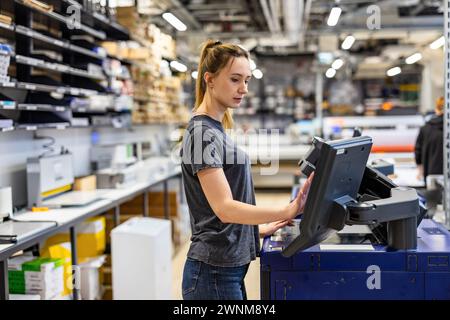 Woman working in a printing factory Stock Photo