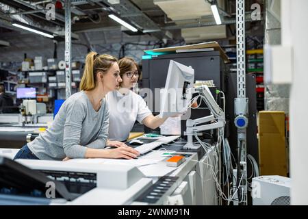 Professional female employees working in a printing house Stock Photo
